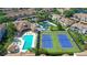 Aerial view showing tennis courts and pool at 4250 Players Pl # 2615, Sarasota, FL 34238