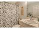 Clean bathroom with a shower/tub combo and pedestal sink at 4250 Players Pl # 2615, Sarasota, FL 34238