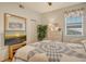 Comfortable bedroom with a full-size bed and a large TV at 4250 Players Pl # 2615, Sarasota, FL 34238