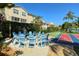 Relaxing community patio with round table and chairs for gatherings at 4250 Players Pl # 2615, Sarasota, FL 34238