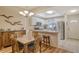 Bright dining room with a wooden table and chairs, adjacent to the kitchen at 4250 Players Pl # 2615, Sarasota, FL 34238