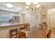 Dining area with wooden table and chairs near the kitchen at 4250 Players Pl # 2615, Sarasota, FL 34238