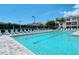 Resort-style pool with multiple lounge chairs at 4250 Players Pl # 2615, Sarasota, FL 34238