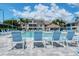 Community swimming pool with lounge chairs and surrounding buildings at 4250 Players Pl # 2615, Sarasota, FL 34238