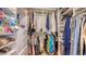 Spacious walk-in closet with custom shelving and ample storage for clothes and accessories at 429 N Rossetti Dr, Nokomis, FL 34275