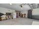 View of the garage featuring epoxy flooring and access door to the home's interior at 429 N Rossetti Dr, Nokomis, FL 34275