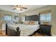 Comfortable main bedroom offering ample natural light and hardwood floors at 429 N Rossetti Dr, Nokomis, FL 34275