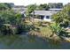 Aerial view of home showcasing the backyard and waterfront access at 4515 Falcon Ridge Dr, Sarasota, FL 34233