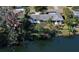 Aerial view of single-story home on a lake at 4515 Falcon Ridge Dr, Sarasota, FL 34233