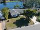 Single-story home, aerial view, showcasing the front yard and landscaping at 4515 Falcon Ridge Dr, Sarasota, FL 34233