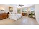 Spacious bedroom with ceiling fan, large windows, and wood dresser at 4515 Falcon Ridge Dr, Sarasota, FL 34233