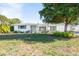 Single-story home with a classic design and green lawn at 4515 Falcon Ridge Dr, Sarasota, FL 34233