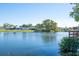 Scenic view of a tranquil lake with houses in the background at 4515 Falcon Ridge Dr, Sarasota, FL 34233