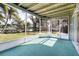 Bright screened porch overlooks a tranquil lake at 4515 Falcon Ridge Dr, Sarasota, FL 34233