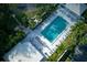 Aerial view of community pool and surrounding landscape at 452 Cerromar Rd # 176, Venice, FL 34293