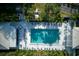 Top-down view of refreshing community pool and surrounding patio at 452 Cerromar Rd # 176, Venice, FL 34293