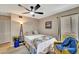 Cozy bedroom with a queen bed and ceiling fan at 452 Cerromar Rd # 176, Venice, FL 34293