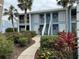 Exterior view showing building entrance and landscaping at 452 Cerromar Rd # 176, Venice, FL 34293