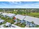 Ground-level view of condo building showcasing a unit's patio at 452 Cerromar Rd # 176, Venice, FL 34293