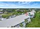 Ground-level view of condo building showcasing a unit's patio at 452 Cerromar Rd # 176, Venice, FL 34293