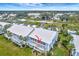 Ground-level view of condo building showcasing a unit's patio at 452 Cerromar Rd # 176, Venice, FL 34293