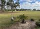 View of the golf course with birds in foreground at 452 Cerromar Rd # 176, Venice, FL 34293