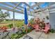 Peaceful patio with pergola, lush landscaping and golf course view at 452 Cerromar Rd # 176, Venice, FL 34293