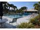 Inviting community pool with lounge chairs and shaded areas at 452 Cerromar Rd # 176, Venice, FL 34293