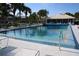 Inviting community pool with lounge chairs and covered seating at 452 Cerromar Rd # 176, Venice, FL 34293