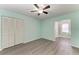 Bedroom with ceiling fan and gray flooring at 4822 30Th Street E Ct, Bradenton, FL 34203