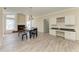 Bright dining room features a chandelier, fireplace, and seating for six at 4822 30Th Street E Ct, Bradenton, FL 34203