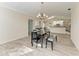 Open concept dining room with kitchen views and a chandelier at 4822 30Th Street E Ct, Bradenton, FL 34203