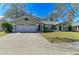 House exterior showcasing a two-car garage and landscaping at 4822 30Th Street E Ct, Bradenton, FL 34203