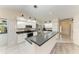 Modern kitchen with stainless steel appliances and breakfast bar at 4822 30Th Street E Ct, Bradenton, FL 34203