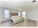 Main bedroom with ceiling fan, en-suite bathroom, and gray walls at 4822 30Th Street E Ct, Bradenton, FL 34203