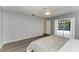 Bedroom with pool view, ceiling fan, and en-suite bathroom at 4822 30Th Street E Ct, Bradenton, FL 34203