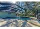 Relaxing screened pool and spa surrounded by lush landscape at 4822 30Th Street E Ct, Bradenton, FL 34203