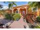 Front entrance with walkway and landscaping at 4850 Sweetshade Dr, Sarasota, FL 34241