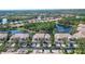 Stunning aerial view of the property showcasing its prime location with lake and lush landscaping at 5208 Parisienne Pl # 202B33, Sarasota, FL 34238