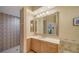 Bathroom with a walk-in shower and single sink vanity at 5208 Parisienne Pl # 202B33, Sarasota, FL 34238