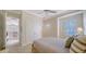 Bright bedroom with a fan, large closet, and a sunny window at 5208 Parisienne Pl # 202B33, Sarasota, FL 34238