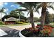 Grand entrance to community, framed by lush landscaping and elegant signage at 5208 Parisienne Pl # 202B33, Sarasota, FL 34238