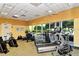 Bright and airy gym with multiple cardio machines and large windows overlooking the landscaped grounds at 5208 Parisienne Pl # 202B33, Sarasota, FL 34238