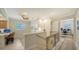 Upstairs hallway with desk and chair in bonus space and decorative railing on the stairs at 5208 Parisienne Pl # 202B33, Sarasota, FL 34238