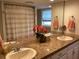 Double vanity bathroom with granite countertops at 521 Wedge Ln, Longboat Key, FL 34228