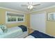 Twin bedroom with light blue bedding and navy blankets at 521 Wedge Ln, Longboat Key, FL 34228