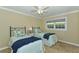 Twin bedroom with light blue bedding and navy blankets at 521 Wedge Ln, Longboat Key, FL 34228