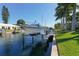 Private boat dock with lift in a peaceful canal at 521 Wedge Ln, Longboat Key, FL 34228