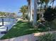 Private boat dock with lush landscaping and canal access at 521 Wedge Ln, Longboat Key, FL 34228