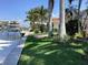 Private boat dock and lush landscaping providing convenient water access at 521 Wedge Ln, Longboat Key, FL 34228